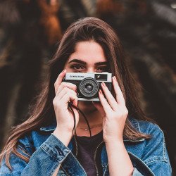 woman-holding-camera-1960183